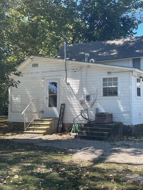 back of property with central air condition unit