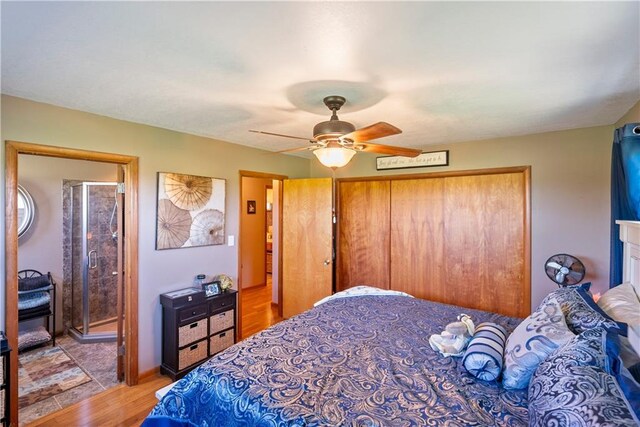 bedroom with hardwood / wood-style floors and ceiling fan