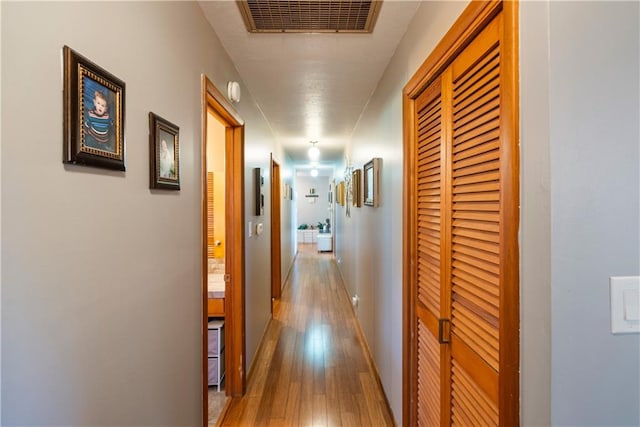 corridor featuring hardwood / wood-style floors