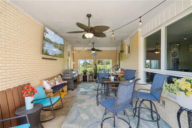 sunroom / solarium with ceiling fan