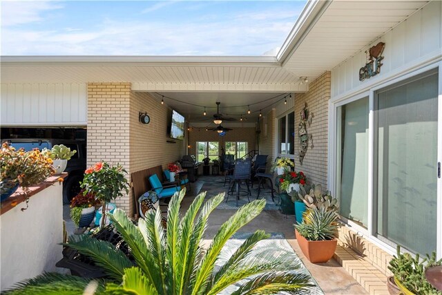 view of patio with ceiling fan and an outdoor hangout area