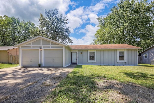 ranch-style house with a garage and a front yard