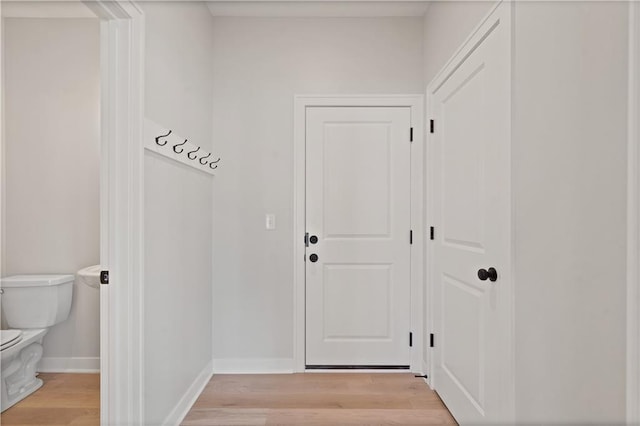 entryway featuring light wood-style floors and baseboards