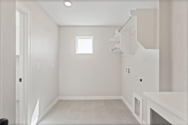 laundry room featuring baseboards, light tile patterned floors, laundry area, hookup for a washing machine, and hookup for an electric dryer