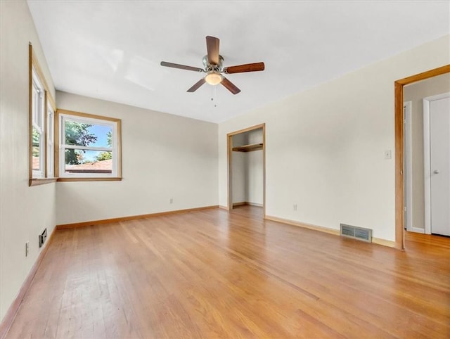 spare room featuring ceiling fan and light hardwood / wood-style flooring