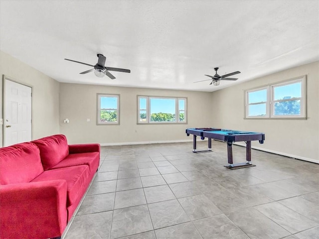 recreation room with ceiling fan, pool table, and light tile patterned floors