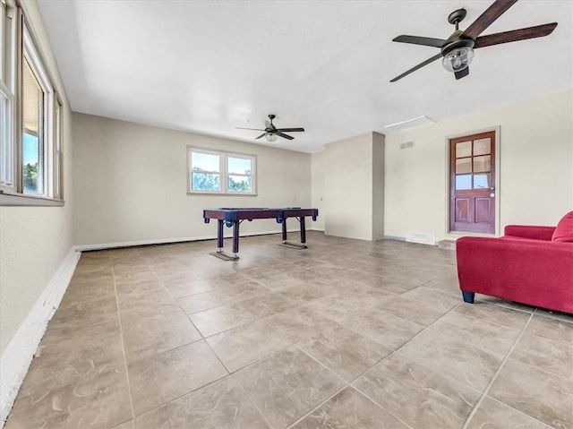 playroom featuring ceiling fan and light tile patterned floors