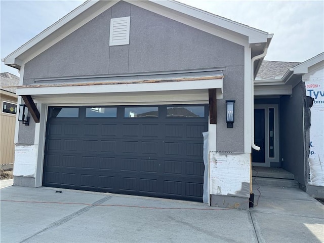 exterior space with concrete driveway