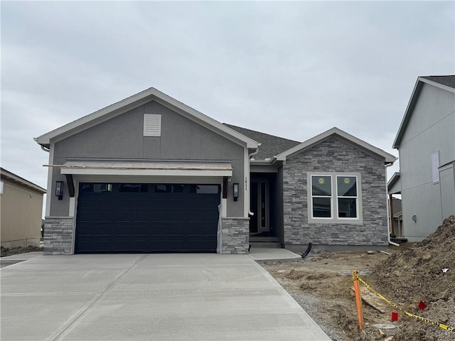 ranch-style house featuring stone siding, stucco siding, driveway, and an attached garage