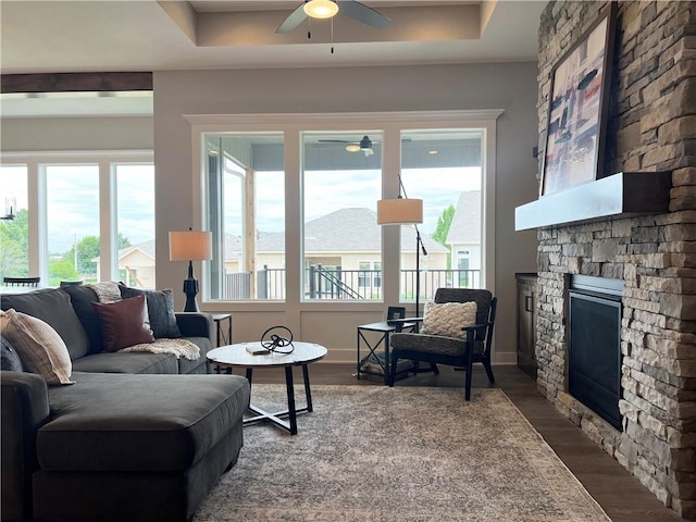 1511 SW Arbor Park Dr, Lees Summit, MO 64082 - living area featuring a ceiling fan, a stone fireplace, and wood finished floors