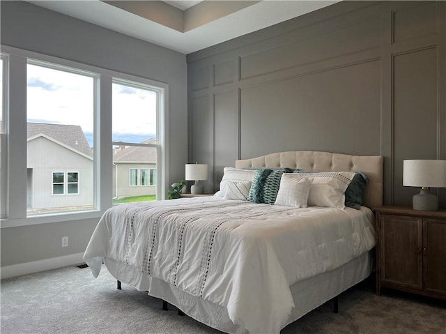 1511 SW Arbor Park Dr, Lees Summit, MO 64082 - carpeted bedroom featuring a decorative wall and baseboards