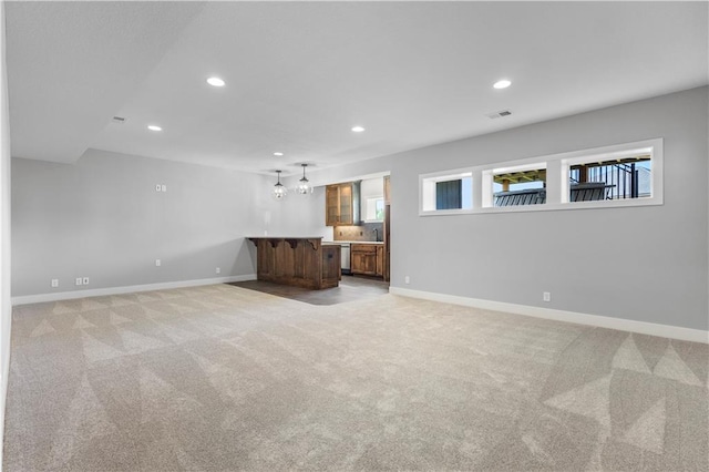 1511 SW Arbor Park Dr, Lees Summit, MO 64082 - unfurnished living room featuring recessed lighting and light colored carpet