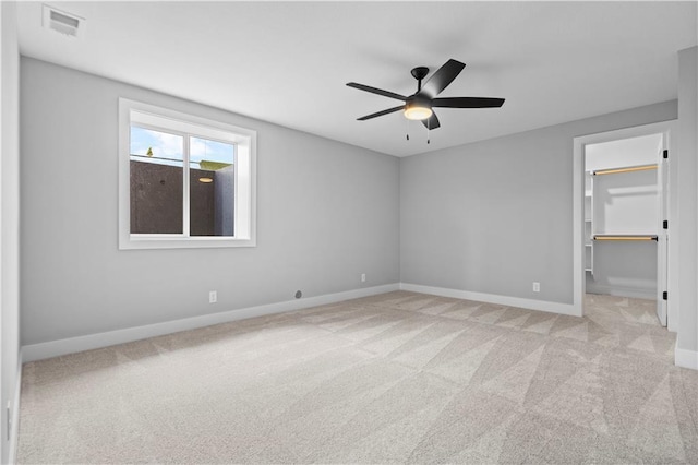 1511 SW Arbor Park Dr, Lees Summit, MO 64082 - unfurnished bedroom featuring carpet, a walk in closet, a ceiling fan, and a closet
