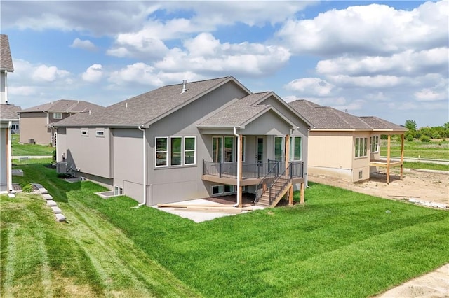 1511 SW Arbor Park Dr, Lees Summit, MO 64082 - rear view of house with a yard, a deck, a shingled roof, and a patio
