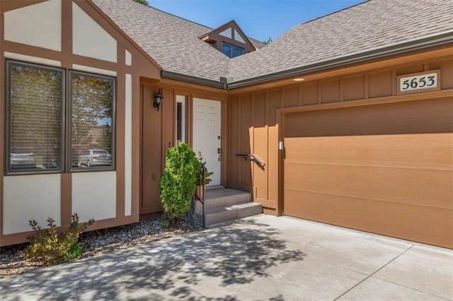 doorway to property featuring a garage