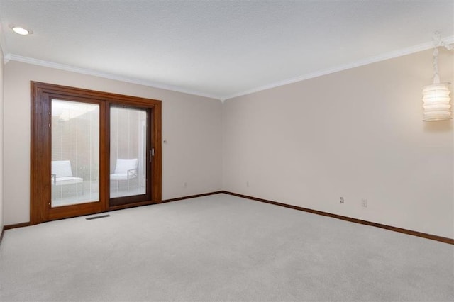 unfurnished room featuring crown molding and light carpet