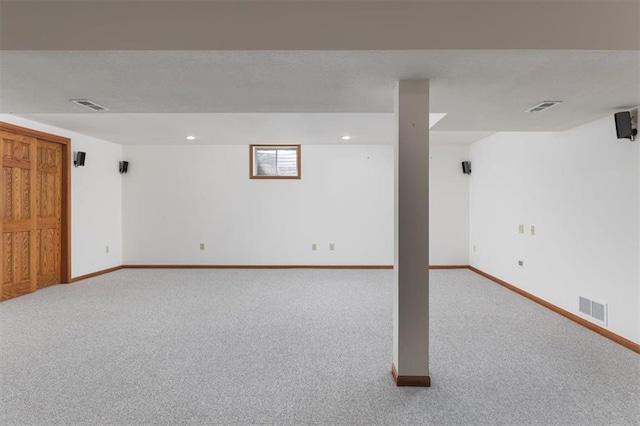 basement with light colored carpet