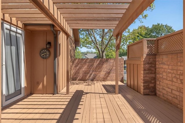 wooden deck featuring a pergola