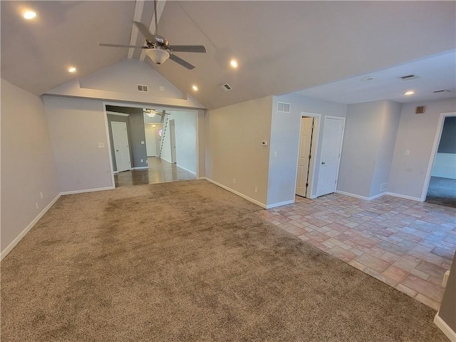 unfurnished room with ceiling fan, light colored carpet, and lofted ceiling with beams