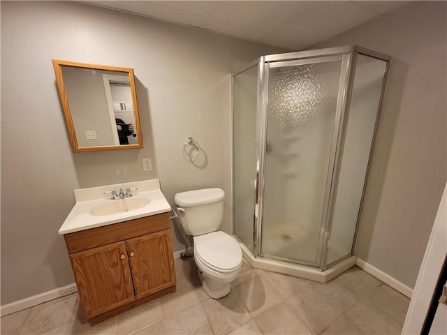 bathroom with tile patterned floors, vanity, toilet, and an enclosed shower