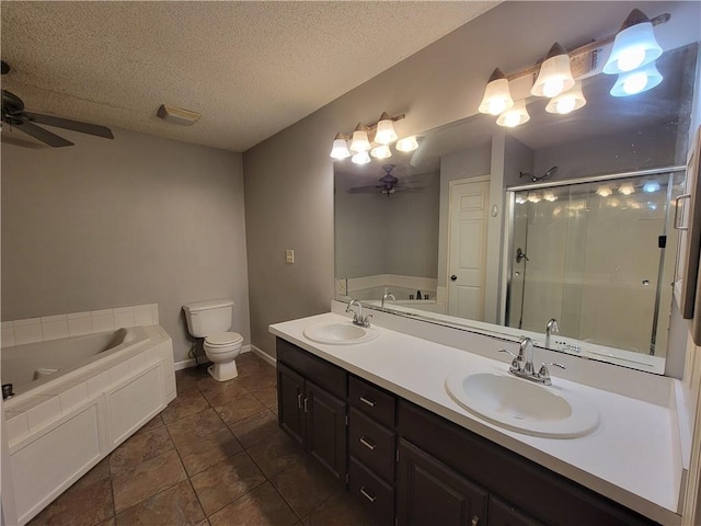 full bathroom featuring vanity, ceiling fan, toilet, shower with separate bathtub, and a textured ceiling