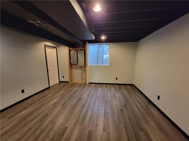 basement featuring wood-type flooring