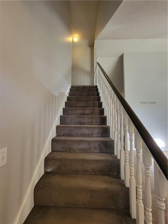 staircase with carpet flooring