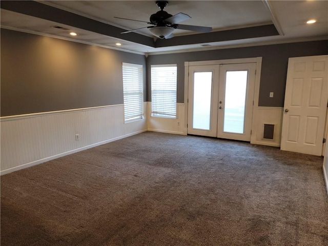 unfurnished room with ceiling fan, french doors, carpet, and crown molding