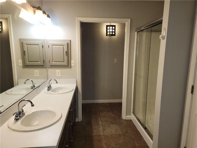 bathroom featuring vanity and an enclosed shower