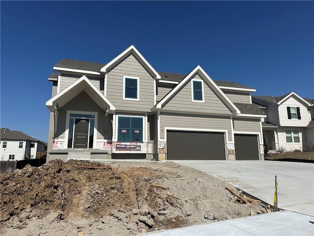 view of front of property featuring a garage and driveway