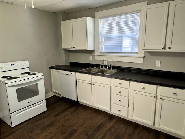 kitchen featuring dark wood-type flooring, white cabinets, white appliances, and sink