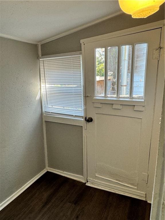 doorway to outside with crown molding and dark hardwood / wood-style flooring