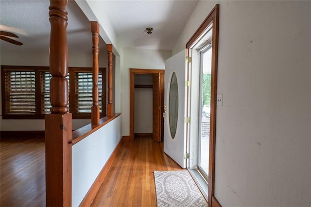 corridor featuring hardwood / wood-style floors