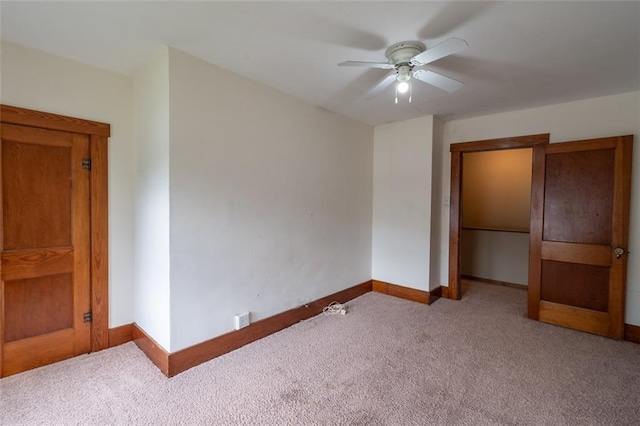 unfurnished bedroom with a closet, ceiling fan, and carpet