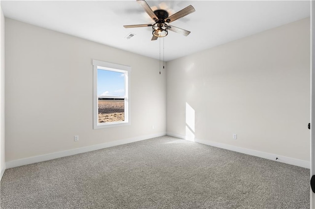 spare room with carpet floors and ceiling fan