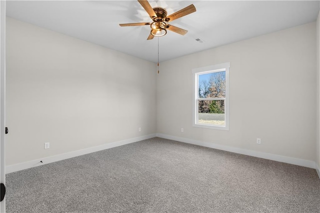 unfurnished room with ceiling fan and carpet flooring