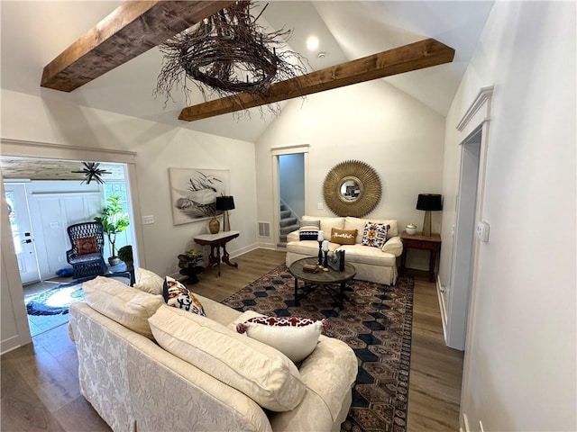 living room with lofted ceiling with beams and dark hardwood / wood-style flooring