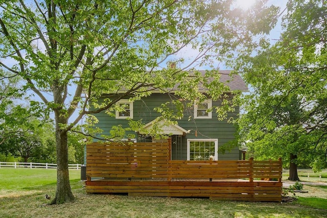 view of side of home featuring a yard