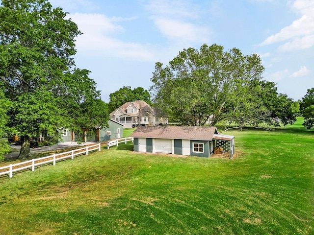 exterior space featuring an outdoor structure and a lawn