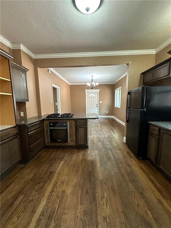 kitchen featuring a chandelier, black appliances, dark hardwood / wood-style floors, dark brown cabinets, and a textured ceiling