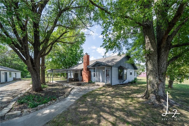 exterior space featuring a lawn and a carport