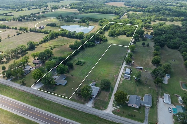 drone / aerial view with a rural view and a water view