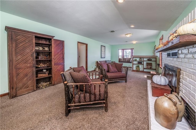 carpeted living room featuring lofted ceiling and a fireplace