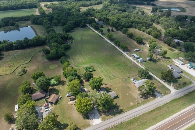 drone / aerial view with a water view and a rural view