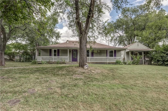 exterior space with a porch and a lawn