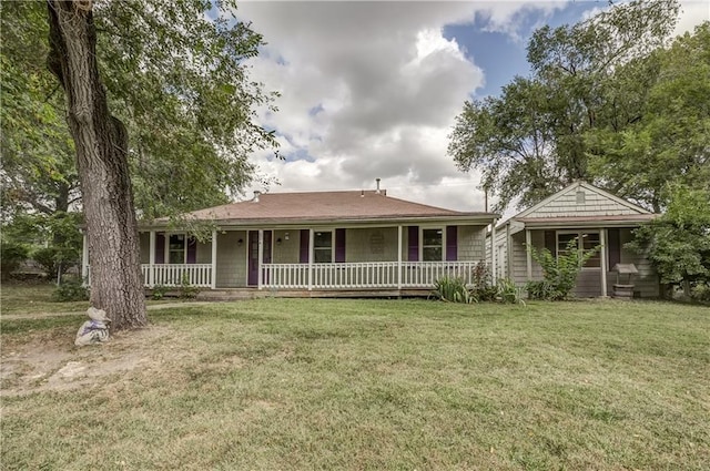 single story home featuring a front yard and covered porch