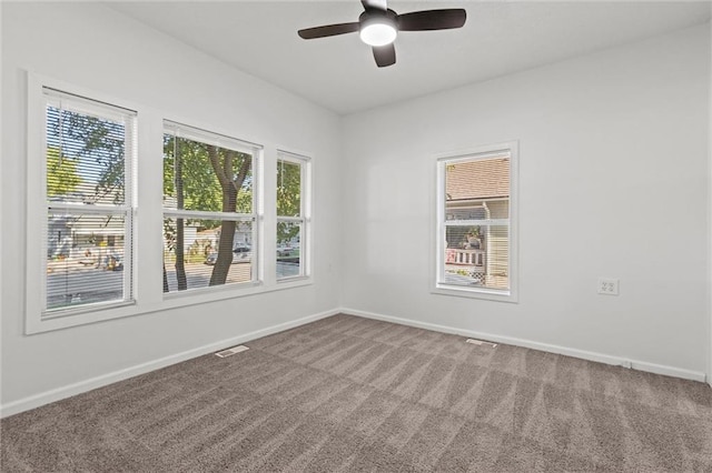 carpeted empty room with ceiling fan