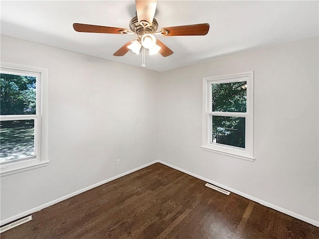 spare room with visible vents, baseboards, and ceiling fan