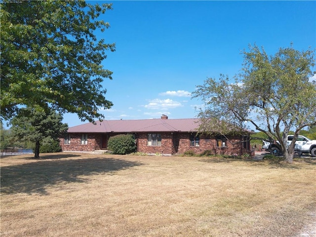 ranch-style house with a front lawn