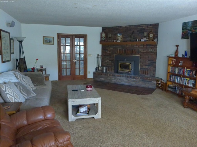 living room with french doors, carpet floors, a textured ceiling, and a brick fireplace